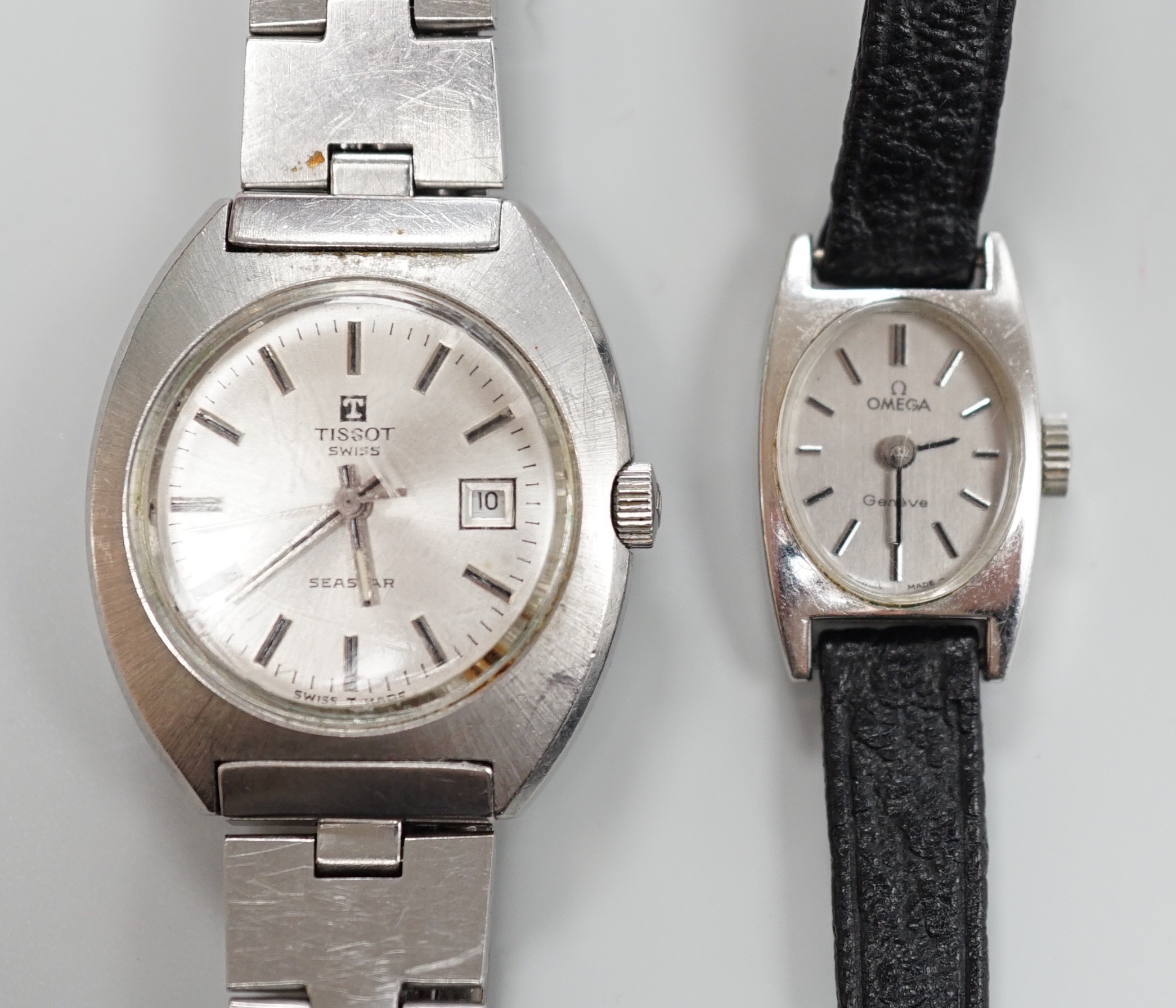 A lady's stainless steel Omega manual wind wrist watch, case diameter 16mm, with Omega box and a similar Tissot wrist watch.